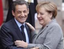Merkel si Sarkozy vor sa...