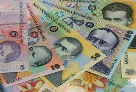 Moneda nationala s-a depreciat spre finalul sedintei interbancare