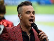 Robbie Williams vrea să...