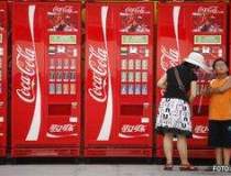 Profitul Coca-Cola din T2 a...