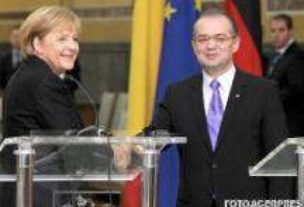 Merkel, catre Boc: Firmele germane reclama modul de atribuire a contractelor publice