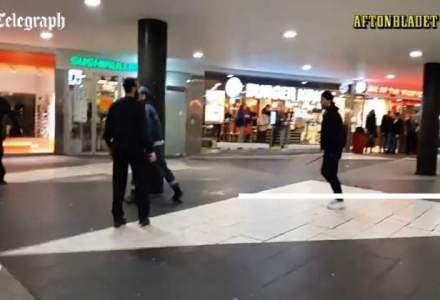 Aproximativ 100 de barbati mascati au agresat migranti in Stockholm