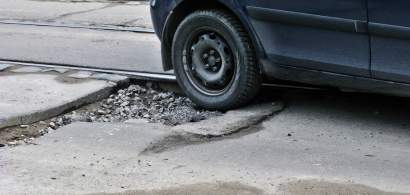 "Craterele" din asfalt, calvarul soferilor din Bucuresti: costul repararii...